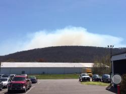 A column of smoke rises over Catawissa Mountain, as seen from the Press Enterprise parking lot Monday. (Peter Kendron/Press Enterprise)