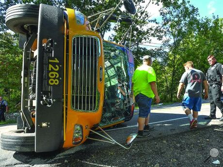 A Southern Columbia School Bus sits on its drivers side blocking both lanes of Route 478 north of the school Thursday afternoon. 