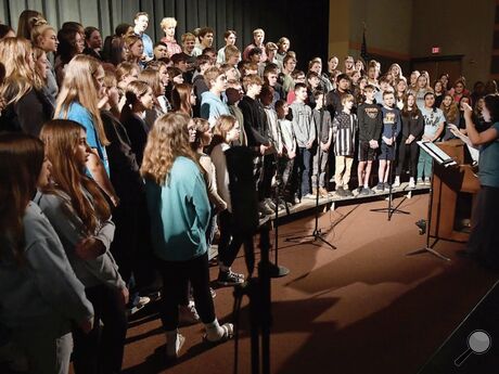 Jennifer DiLossi, at far right, directs the chorus during a rehearsal Monday morning in the Benton High School Auditorium. The school will present the “Melodies of Spring” concert Wednesday at 7 p.m. in the auditorium. 