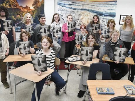 Bloomsburg High students brought back the literary magazine “Prometheus” for the first time in more than a decade. Holding copies are, from left, seated: Will Phillips, Emily Schultz, Toby Livingstone, Olivia Whitmire and Adrianna Howell. Standing are Christopher Pepe, Miguel Lopez, Adviser Michelle Hintz, Jason Rivera, Cassie McGinley, Lea Albercht, Katie Studebaker, Madison Haydt, Jylian Bohner and Emma Whitmire.