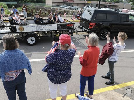 Members of the Shickshinny American Legion Post, above, ride along Main Street in a Memorial Day parade on Monday..