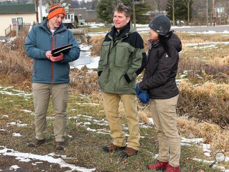 Jared Ressler, left, and Jason Fellon of the Department of Environmental Protection talk with Columbia County Conservation District manager Nancy Corbin near the Bloomsburg Recycling Center on Tuesday afternoon. The conservation district has received a $245,000 grant to help with Kinney Run flooding