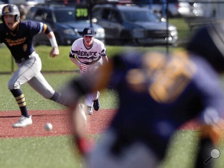 Berwick's Nick Uram, center, fields the ball off the bat of Montoursville’s Jordan Wilson, right, as Royce Bowes heads toward third during the second inning. Uram threw the ball to second and Berwick turned the double play to end the frame Monday afternoon in Berwick.