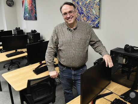 Ammon Young, director of the Bloomsburg Public Library, stands in the technology lab last week. The library will soon have a worker assigned to increase the computer literacy of older or less tech-savvy patrons.