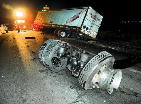 A set of wheels came to rest in the middle of the westbound lanes of Interstate 80 near Mifflinville Monday night after this tractor-trailer struck guardrails on I-80 before the Route 239 overpass and took out about another 100 feet of rail after the bridge. The driver was not hurt in the accident.