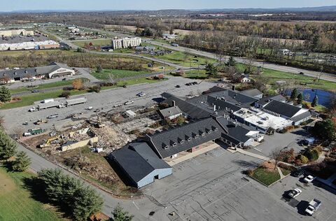 Demolition begins Monday, above, on the former Country Cupboard Restaurant and Gift Shops in Kelly Township, just north of Lewisburg, along Route 15. The property was purchased by Evangelical Community Hospital.