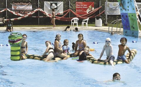 Children climb on the new floatable water snake in the Ber-Vaughn Pool, operated by the Berwick Area Swimming Pool Inc., on Thursday afternoon. The snake replaces an older red and yellow floatable snake that had been in the water since the refurbished pool opened several years ago. The snake and a new floatable turtle were purchased with funding from the Community Giving Foundation. 