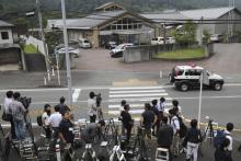 Journalists gather in front of Tsukui Yamayuri-en, a facility for the handicapped where a number of people were killed and dozens injured in a knife attack in Sagamihara, outside Tokyo Tuesday, July 26, 2016. (AP Photo/Eugene Hoshiko)