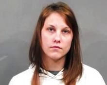 FILE - In this May 24, 2018, file booking photo, provided by the Sedgwick County Sheriff’s Office in Wichita, Kan., shows Emily Glass, of Wichita, after her arrest and booking into the Sedgwick County jail after a body that is believed to be her stepson, Lucas Hernandez, was found in a nearby county. Prosecutors never charged her in Lucas' death, but said she was a person of interest. Police announced at a press briefing Friday, June 8, 2018, that Glass was found dead early Friday in a Wichita home. Jonatha