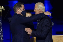 FILE - In this Nov. 7, 2020, file photo, President-elect Joe Biden, right, embraces his son Hunter Biden, left, in Wilmington, Del. Biden’s son Hunter says he has learned from federal prosecutors that his tax affairs are under investigation. (AP Photo/Andrew Harnik, Pool)