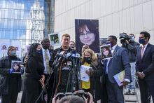 Juan Pablo Orellana Larenas, father of Valentina Orellana-Peralta, speaks during a news conference outside the Los Angeles Police Department headquarters in Los Angeles, Tuesday, Dec. 28, 2021. The parents of Valentina Orellana-Peralta, the 14-year-old girl killed by a stray bullet fired by an LAPD officer at a North Hollywood clothing store last week, and their attorneys held a news conference to discuss the family's demand for transparency from the Los Angeles Police Department. At center left is attorney