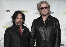 FILE - Hall of Fame Inductees, Hall & Oates, John Oates and Daryl Hall appear in the press room at the 2014 Rock and Roll Hall of Fame Induction Ceremony on April, 10, 2014, in New York. Hall has sued his longtime music partner John Oates, arguing that his plan to sell off his share of a joint venture would violate a business agreement the duo had. (Photo by Andy Kropa/Invision/AP, File)