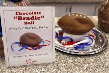 A "deflated" chocolate football called a "Bradie" Ball is on display at Sarris Candy store in in Canonsburg, Pa., on Wednesday, Jan. 28, 2015. (AP Photo/Keith Srakocic)