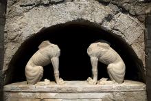 In this handout photo released by the Greek Culture Ministry on Thursday, Aug. 21, 2014, two large stone sphinxes are seen under a barrel-vault topping the entrance to an ancient tomb under excavation at Amphipolis in northern Greece.