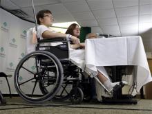 Brett Hurt, 16, a sophomore at Franklin Regional High School in Murrysville, Pa.,and a victim in the stabbings that took place their on April 9, sits in a wheelchair next to his mother Amanda Leonard during a news conference at Forbes Regional Hospital, Thursday, April 10, 2014, in Monroeville, Pa. Authorities have charged Alex Hribal, 16, with four counts of attempted homicide and 21 counts of aggravated assault in the attack. (AP Photo/Keith Srakocic)