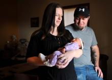 Amanda and Mark Anders of Missoula, Mont., admire their new baby girl, Nicollette Brynn Anders, at their home on Thursday, Nov. 14, 2013. Nicollette Brynn Anders was born in the 11th month, on the 12th day in the 13th year at 14:15 military time. (AP Photo/Michael Gallacher, The Missoulian)