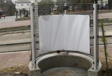  In this Jan. 28, 2016 file photo, a woman looks at the fencing of an outdoor urinal at a San Francisco MUNI streetcar stop across from Dolores Park in San Francisco. A religious organization is suing the city San Francisco to remove the open-air urinal it calls unsanitary and offensive to the senses from a popular park. (AP Photo/Jeff Chiu, File)