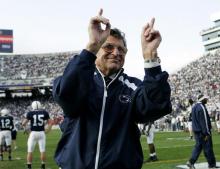  In this Nov. 5, 2005, file photo, Penn State football coach Joe Paterno acknowledges the crowd during warm-ups before an NCAA college football game against Wisconsin in State College, Pa. As Penn State's athletic department finalizes details for how to honor the 50th anniversary of Joe Paterno’s first win, hundreds of the late coach’s former players were on their way to town to attend a private reunion planned for Friday at the school’s baseball stadium. (AP Photo/Carolyn Kaster, File)