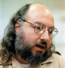 In this May 15, 1998 file photo, Jonathan Pollard speaks during an interview in a conference room at the Federal Correction Institution in Butner, N.C. (AP Photo/Karl DeBlaker, File)