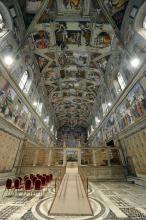 This picture made available Tuesday, March 12, 2013 by the Vatican newspaper L'Osservatore Romano shows the Sistine Chapel set up for the beginning of the conclave, at the Vatican. Cardinals enter the Sistine Chapel on Tuesday to elect the next pope amid more upheaval and uncertainty than the Catholic Church has seen in decades: There's no front-runner, no indication how long voting will last and no sense that a single man has what it takes to fix the many problems. (AP Photo/L'Osservatore Romano, ho)