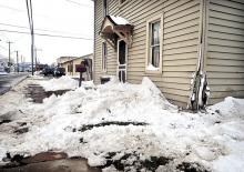 Damage is seen to the front corner of Scott Chappell’s house at 601 Old Berwick Road in Bloomsburg, on Tuesday afternoon, after it was hit by a car earlier in the day. (Press Enterprise/Bill Hughes)