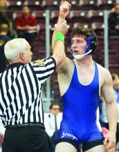 Central Columbia's Jake Coombe has his hand raised by the referee after beating Fort Leboeuf's Jack Middleton 4-3 Thursday at Hershey. (Press Enterprise/Keith Haupt)