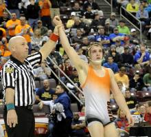 Referee Bernie Hostetter holds up the hand of Benton's Zain Retherford after beating Line Mountain's Seth Lansberry to win the 138-pound championship match Saturday afternoon during the PIAA, Class AA Wrestling Championships at the Giant Center in Hershey. (Jimmy May/Press Enterprise)