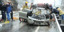 Two people were trapped in this overturned car along Route 42 in Hemlock Township Wednesday afternoon. Buckhorn fire company, Bloomsburg ambulance and Danville ambulance assisted on the scene. Driver David Earnest, 17, and passenger Ceirra Earnest, 14, were able to make their way to stretchers after being helped from the car. (Press Enterprise/Keith Haupt)