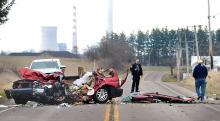 State police reconstruction team members and fire personnel survey the scene of this fatal accident on Route 54 near Route 44 in Anthony Township Tuesday morning. (Keith Haupt/Press Enterprise)