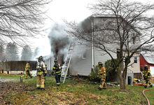 Firefighters battle a smoky fire Thursday morning at 33 Valley Road in Briar Creek Township.