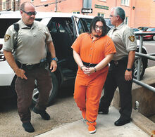 Press Enterprise/Bill Hughes Convicted murderer Adrian Sura-Reyes is escorted into the Columbia County Courthouse by deputy sheriffs Scott Mayernick, left, and Kevin Bradley for a sentencing hearing before President Judge Gary Norton on Tuesday. 