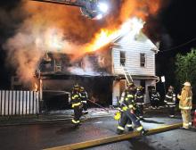 Berwick firefighters work to stop the flames as they rip through this house on Fair Street in Berwick early Tuesday morning. (Press Enterprise/Keith Haupt)