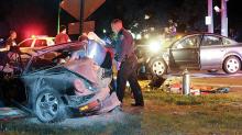 Police and medics work at the scene of a Lightstreet Road crash Friday night. (Press Enterprise/Jimmy May)