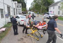 The driver of a sedan was taken to the hospital for treatment after going through a utility pole and then crossing Lightstreet Road before striking Roberts Automotive Service Center Thursday. (Press Enterprise/Jimmy May)