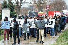 Demonstrators march through the Bloomsburg University campus on Friday afternoon.