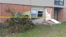 Damage to an Evergreen Pointe apartment building is shown, following an early morning crash.