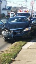 Berwick fire fighters and EMTs work to free Matthew J. Creme, Berwick, from his vehicle following a crash Monday morning.