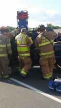 Espy fire fighters work to free 73-year-old Charles Heller from his pickup truck following a two-vehicle accident Wednesday (Press Enterprise/Julye Wemple)