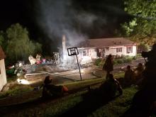 A late-night blaze tore through a house on Schoolhouse Road last night, closing the roadway for over an hour. (Press Enterprise/Geri Gibbons)