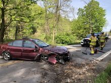 Press Enterprise/Susan Schwartz The driver’s side corner of the Pontiac Grand Am was ripped away by Sunday’s crash, but the mother and 3-year-old in the car were both safely strapped in, police said, and appeared to have escaped serious injury. 