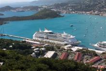 The Royal Caribbean International's Explorer of the Seas is docked at Charlotte Amalie Harbor in St. Thomas, U. S. Virgin Islands, Sunday, Jan. 26, 2014. U.S. health officials have boarded the cruise liner to investigate an illness outbreak that has stricken at least 300 people with gastrointestinal symptoms including vomiting and diarrhea. (AP Photo/Thomas Layer)