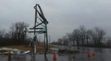 A sign is twisted after a truck slid off Route 11 and struck it early Tuesday. (Press Enterprise/Julye Wemple)