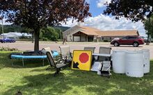A collection of items blown onto the grounds of the NC Church by Wednesday's windstorm awaits its owners. (Press 