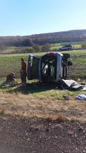 A minivan rests on its side following a three-vehicle accident on Interstate 80, just west of Buckhorn, on Tuesday afternoon.