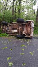 Hayley Davenport's Toyota 4Runner sits on its side following a crash Friday morning on Cryder's Lane in Bloomsburg.