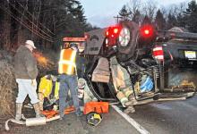 Millville and Unityville fire companies rescue personnel are shown removing driver Roy Sperry from a Nissan Pathfinder SUV. (Press Enterprise/Harry Watts)