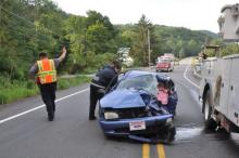 A female driver was killed Wednesday morning when she pulled out into the path of a truck carrying electrical-line workers in Pine Township, just north of the borough on Route 42, officials say. (Harry Watts/For the Press Enterprise)