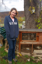 Shawna Rhodes stands next to the cage where the family's fostered raccoon stayed. A Game Commission officer shot the animal dead Thursday morning. (Press Enterprise/Julye Wemple)