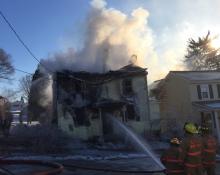 Firefighters battle a blaze at 8 C St., Danville, Friday morning. (Press Enterprise/Chris Krepich)