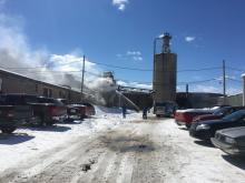 Smoke pours from a silo at Rad Engineered Wood Products. (Press Enterprise/Susan Schwartz)